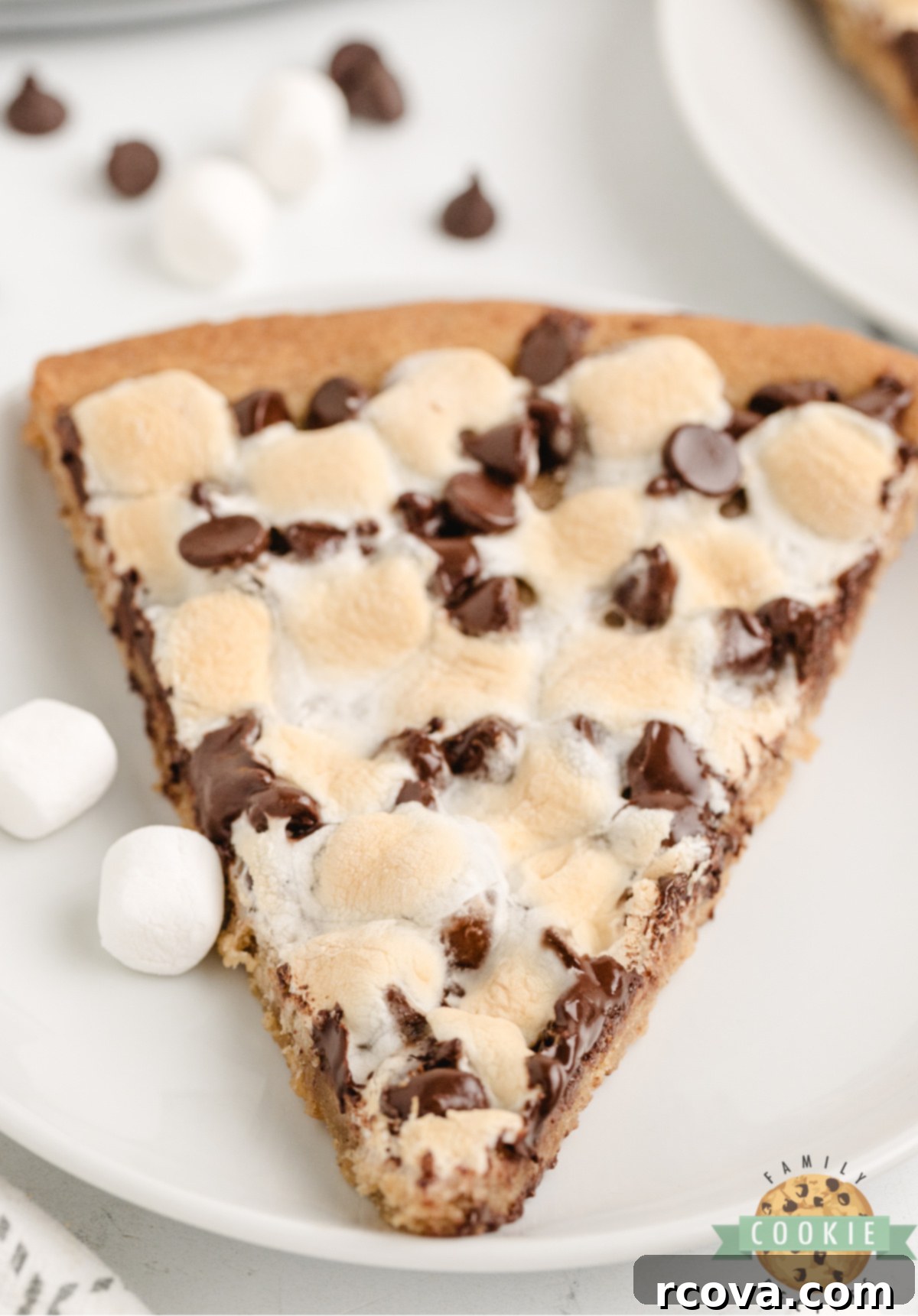 Giant Peanut Butter Cookie Pie 9 Peanut butter cookie pizza topped with chocolate chips and marshmallows.