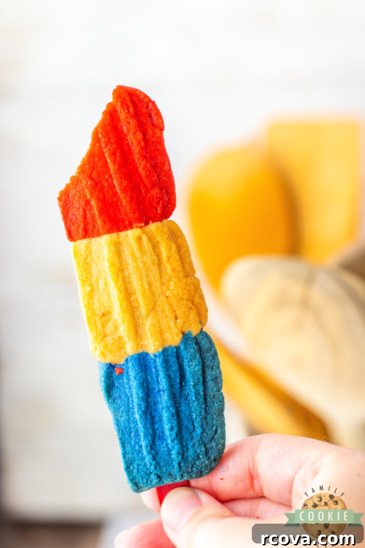 Firecracker Cookie Delights 8 Patriotic cookie on a popsicle stick.