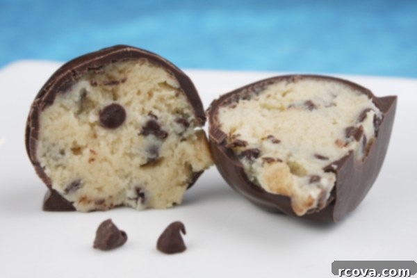 Effortless No-Bake Cookie Delights 30 Chocolate Chip Cookie Dough Truffle cut in half, revealing the edible cookie dough center.