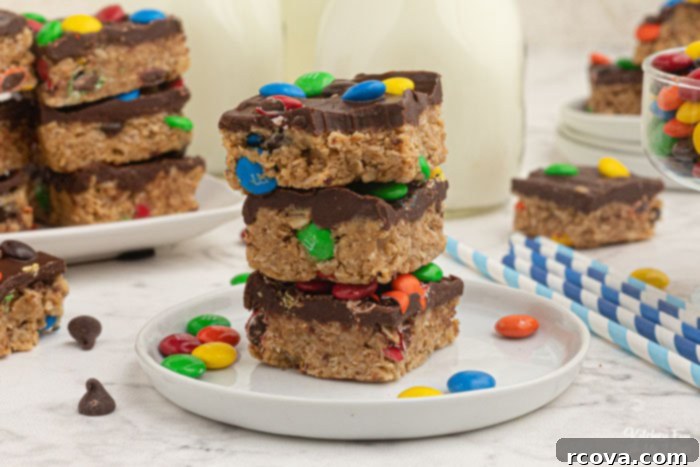 Effortless No-Bake Cookie Delights 45 No-Bake Monster Cookie Bars with M&M's and a layer of chocolate.