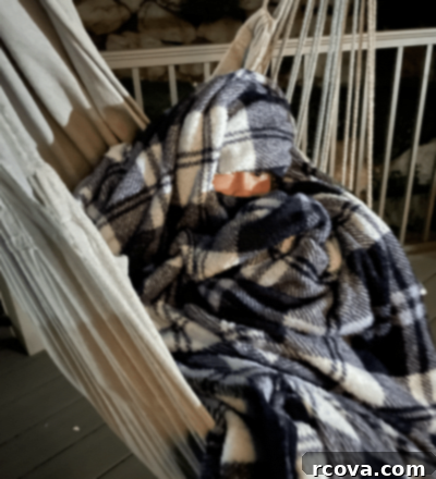 Iced Blueberry Delights 14 A child bundled in a blanket watching a movie outdoors.