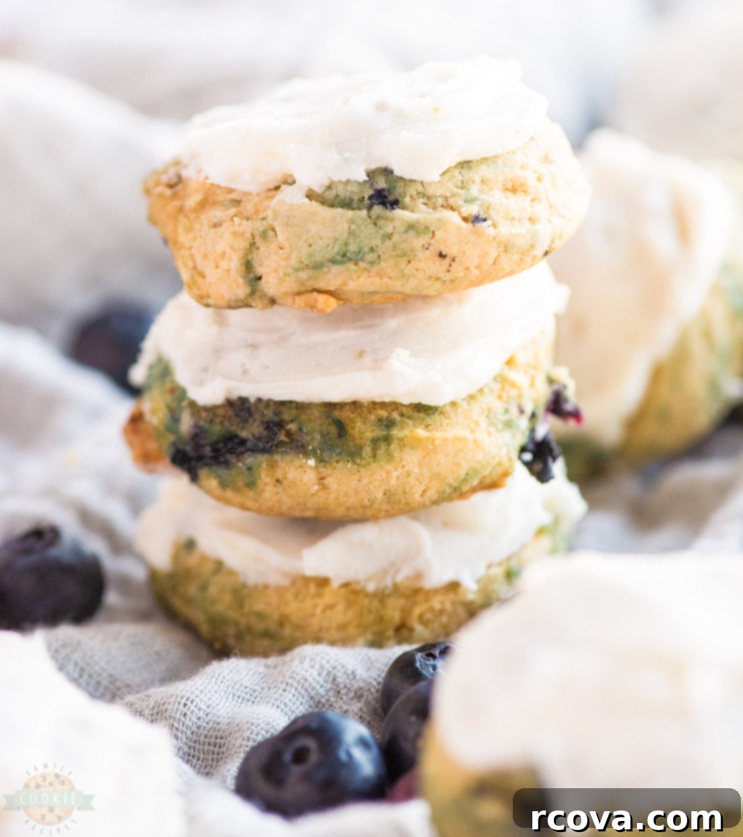Iced Blueberry Delights 8 A stack of frosted blueberry cookies.