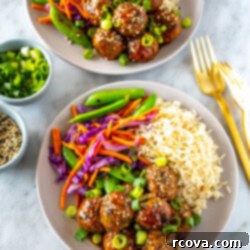 Sticky Teriyaki Chicken Bites 11 Two bowls with a bed of rice, side of stir fried veggies and sticky teriyaki chicken meatballs.