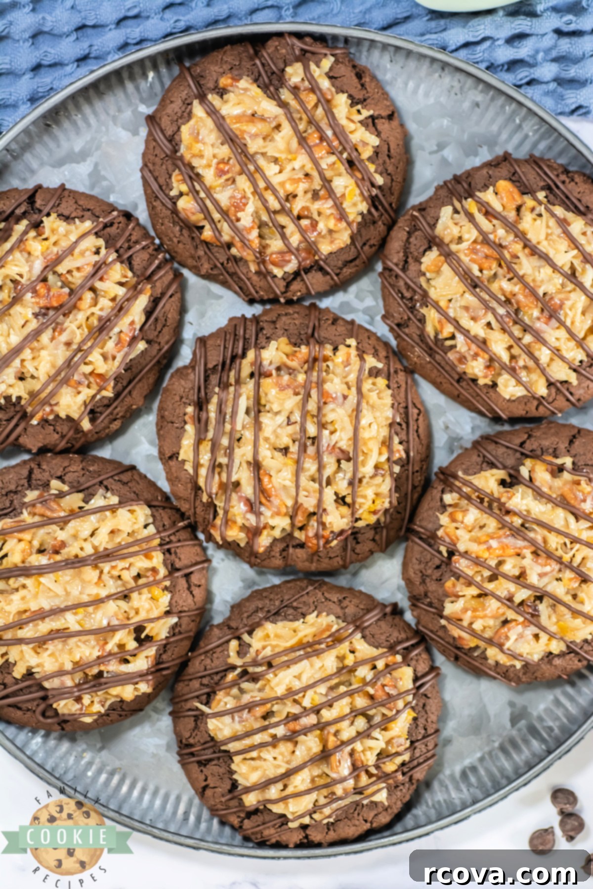 Decadent German Chocolate Cake Cookies Crumbl Style 3 Close-up shot of a chocolate cookie topped generously with creamy coconut and pecan frosting, showcasing its inviting texture.