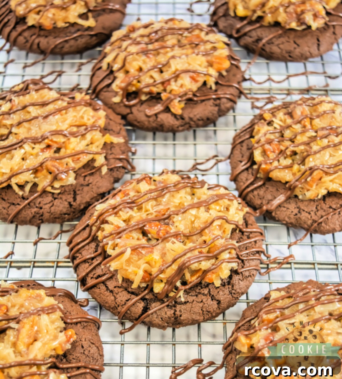 Decadent German Chocolate Cake Cookies Crumbl Style 5 A stack of two rich Crumbl Copycat German Chocolate Cake Cookies, garnished with gooey coconut pecan frosting and a chocolate drizzle.