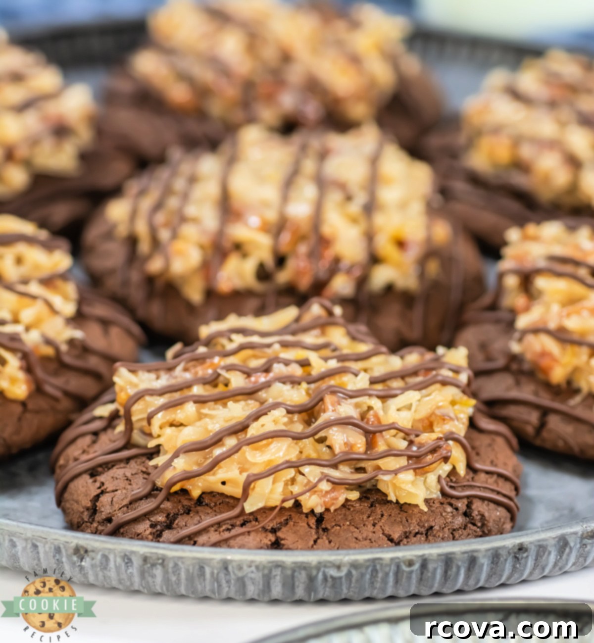 Decadent German Chocolate Cake Cookies Crumbl Style 7 A beautifully presented Crumbl Copycat German Chocolate Cake Cookie, rich in chocolate and topped with creamy coconut pecan frosting and a chocolate drizzle.