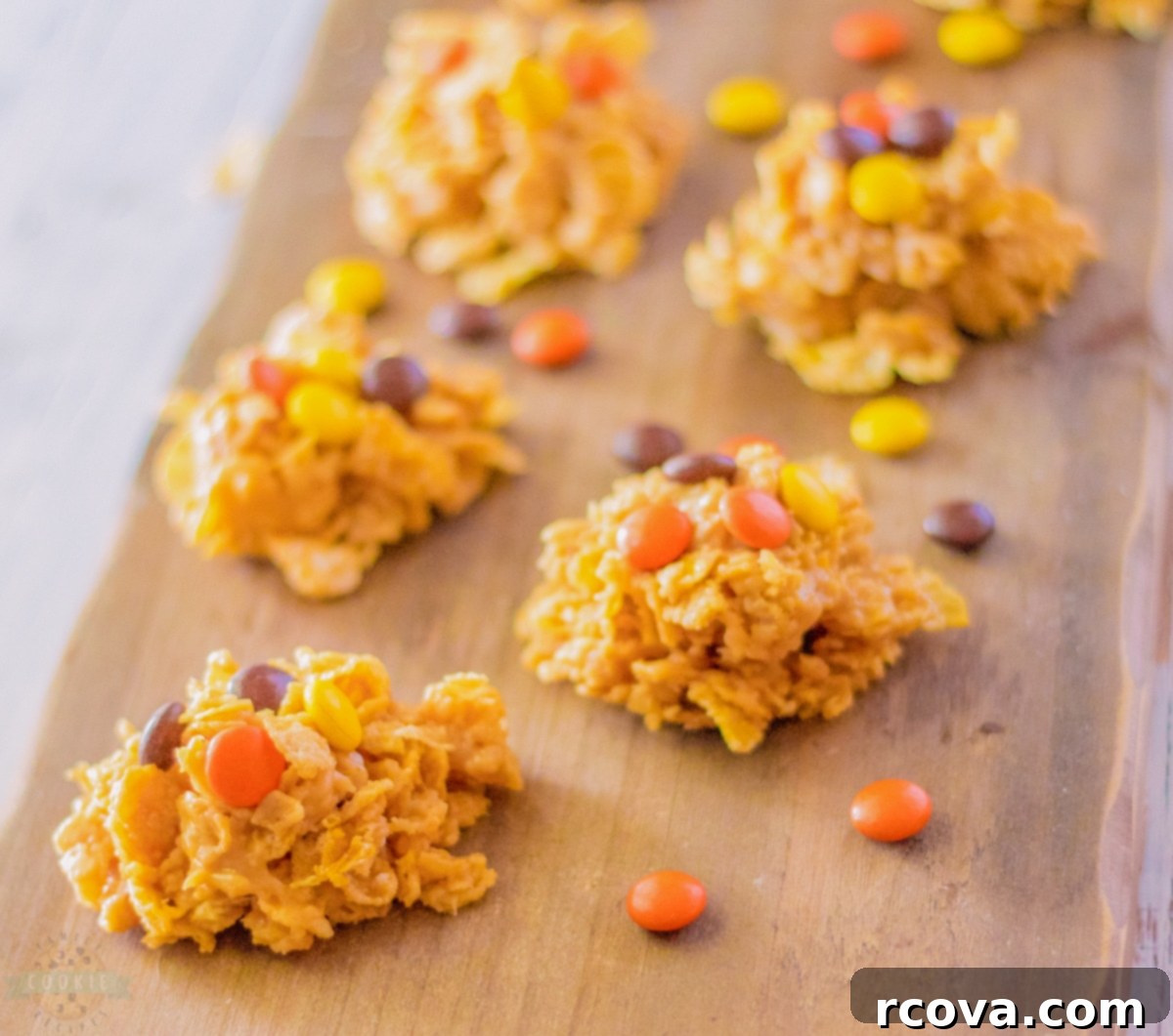Reeses Cornflake Peanut Butter Crunch Cookies 3 Delicious no-bake peanut butter cornflake cookies with Reese's Pieces candy on top, arranged for a mouth-watering display