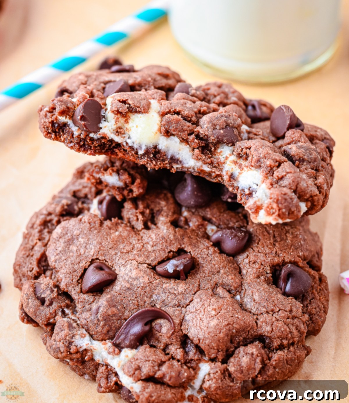 Lush Chocolate Cream Cheese Cookies 6 Close-up of a cream cheese and chocolate cookie with a bite taken out, showing the gooey center
