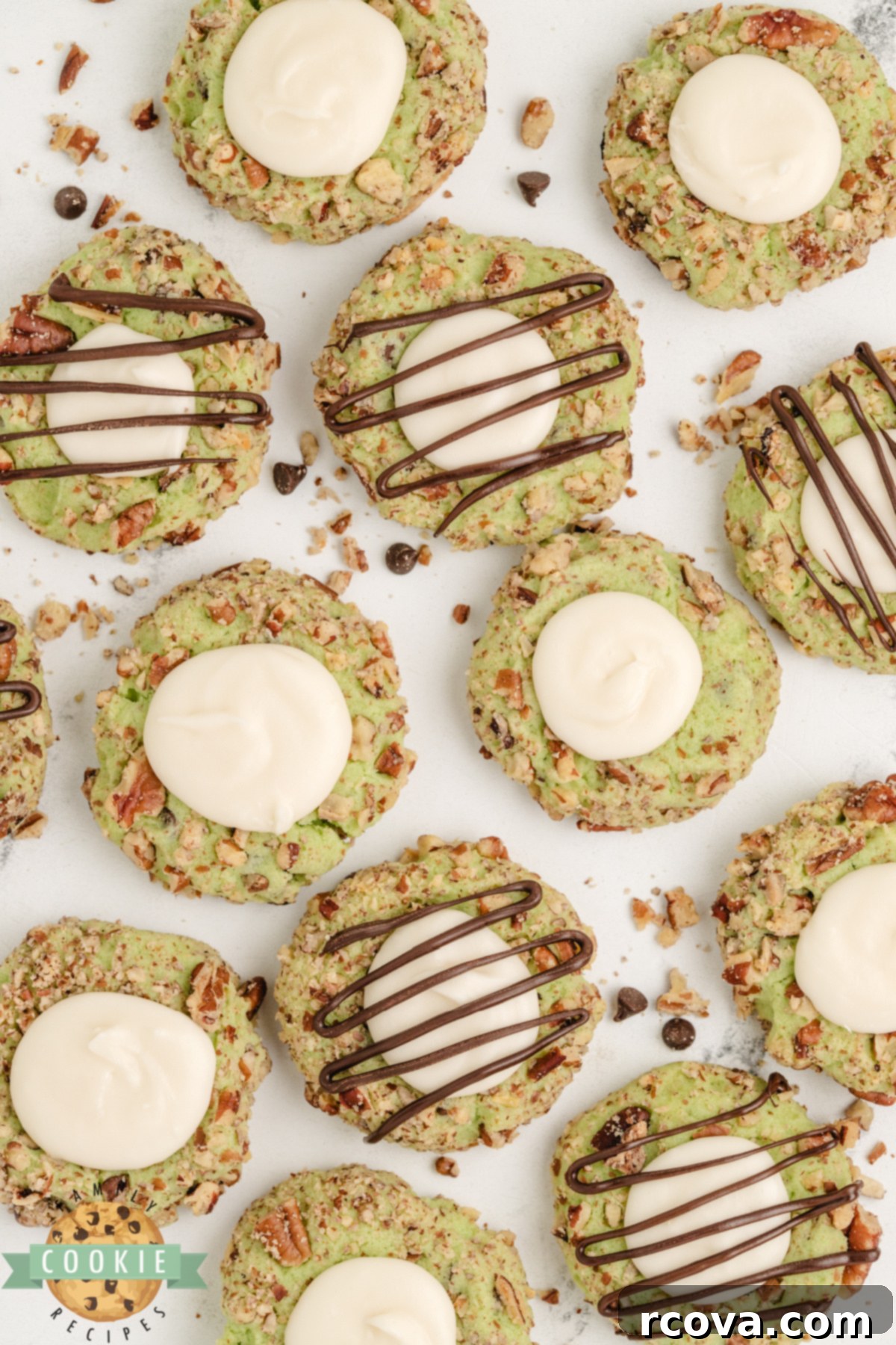 Pistachio Thumbprint Delights 3 Pistachio thumbprint cookies with a creamy buttercream filling.