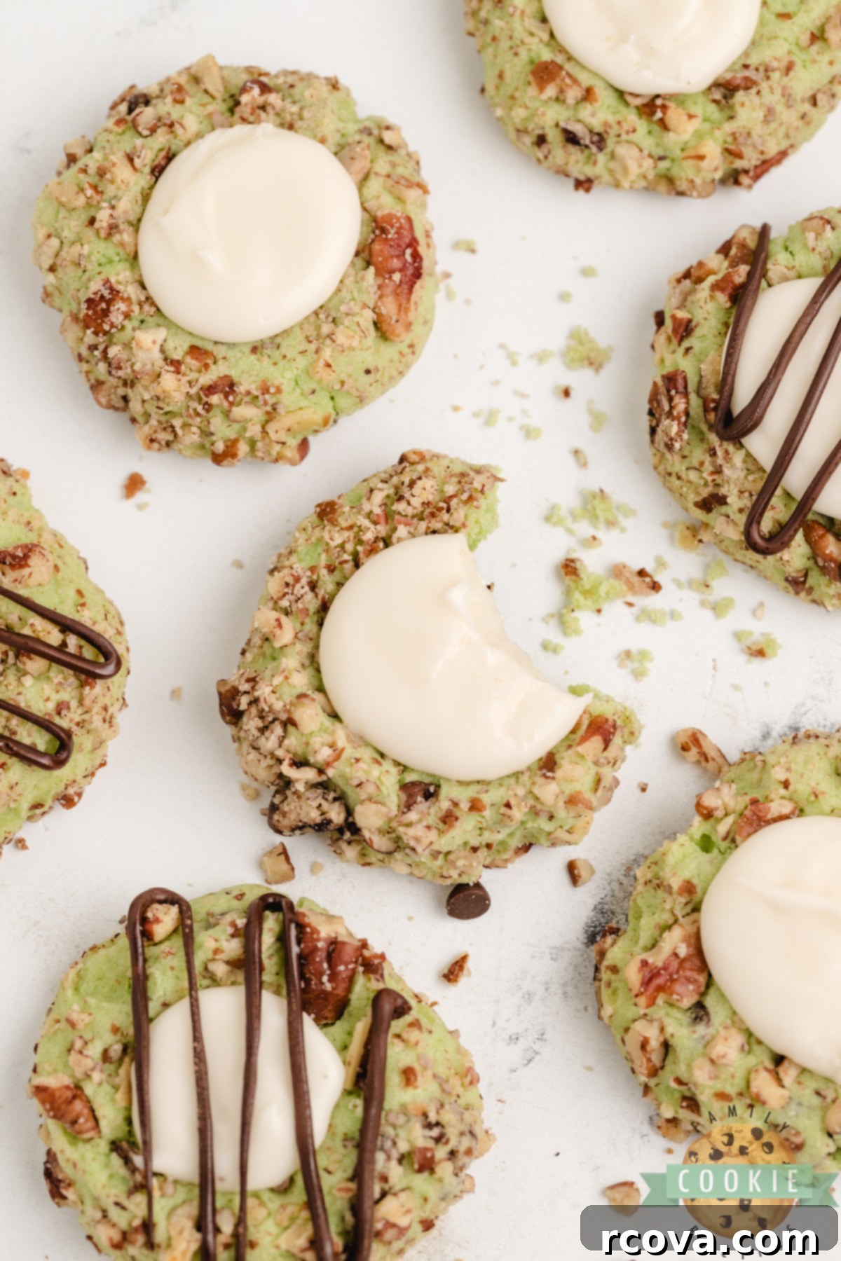 Pistachio Thumbprint Delights 5 Soft pistachio thumbprint cookies with chocolate chips, pecan coating, and vanilla filling—easy to make and absolutely delicious!