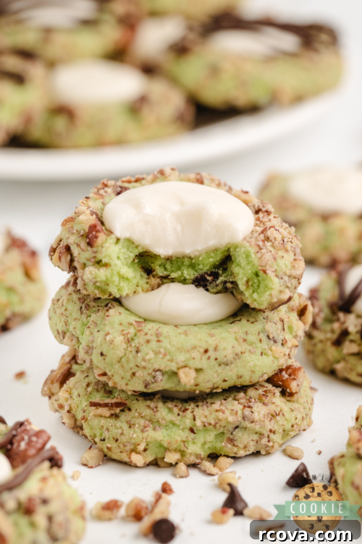 Pistachio Thumbprint Delights 7 Stack of pistachio thumbprint cookies made with buttercream filling.