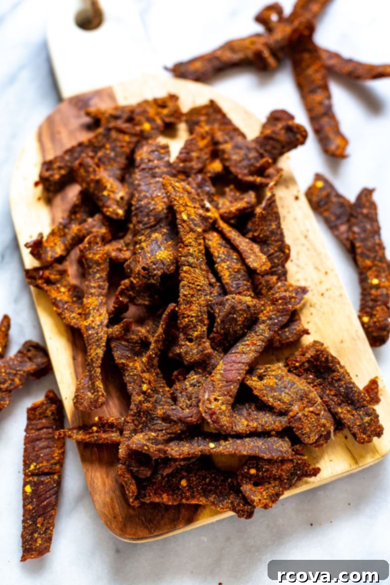 15 Power-Packed Protein Snacks 17 Homemade beef jerky strips drying on a rack, a perfect high-protein snack for adventurers.