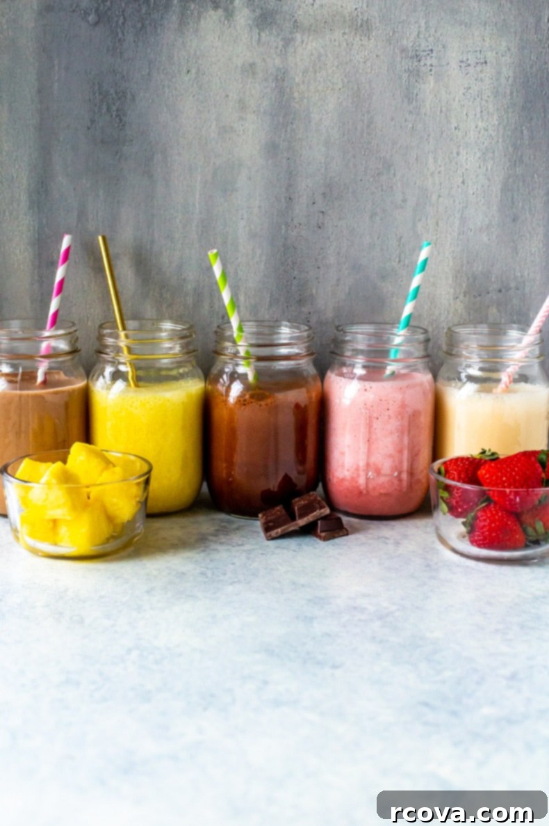 15 Power-Packed Protein Snacks 4 Collection of five different protein shakes in various glasses, garnished with fruit and nuts, illustrating the best protein shake recipes.