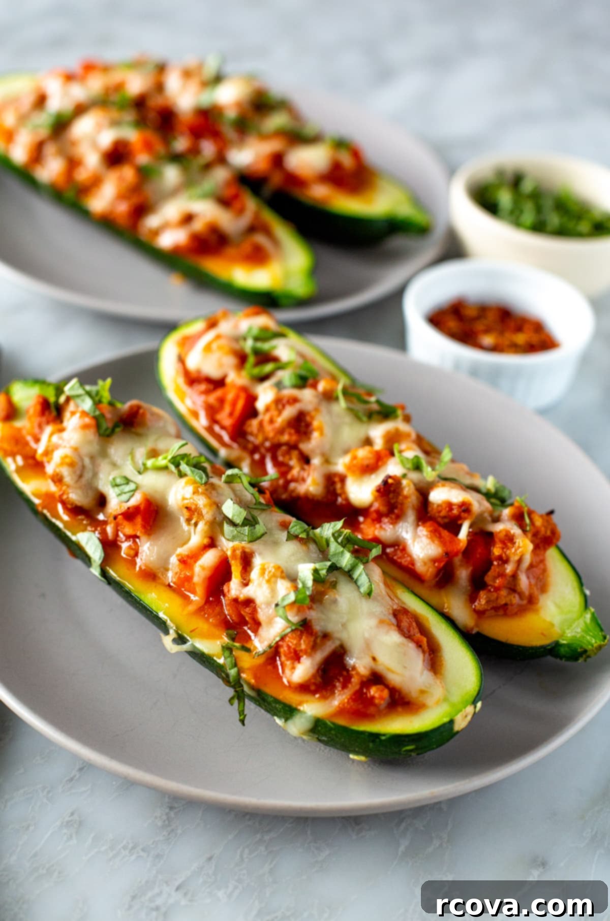 28 Wholesome and Simple Ground Beef Meals 24 Italian zucchini boats on a plate