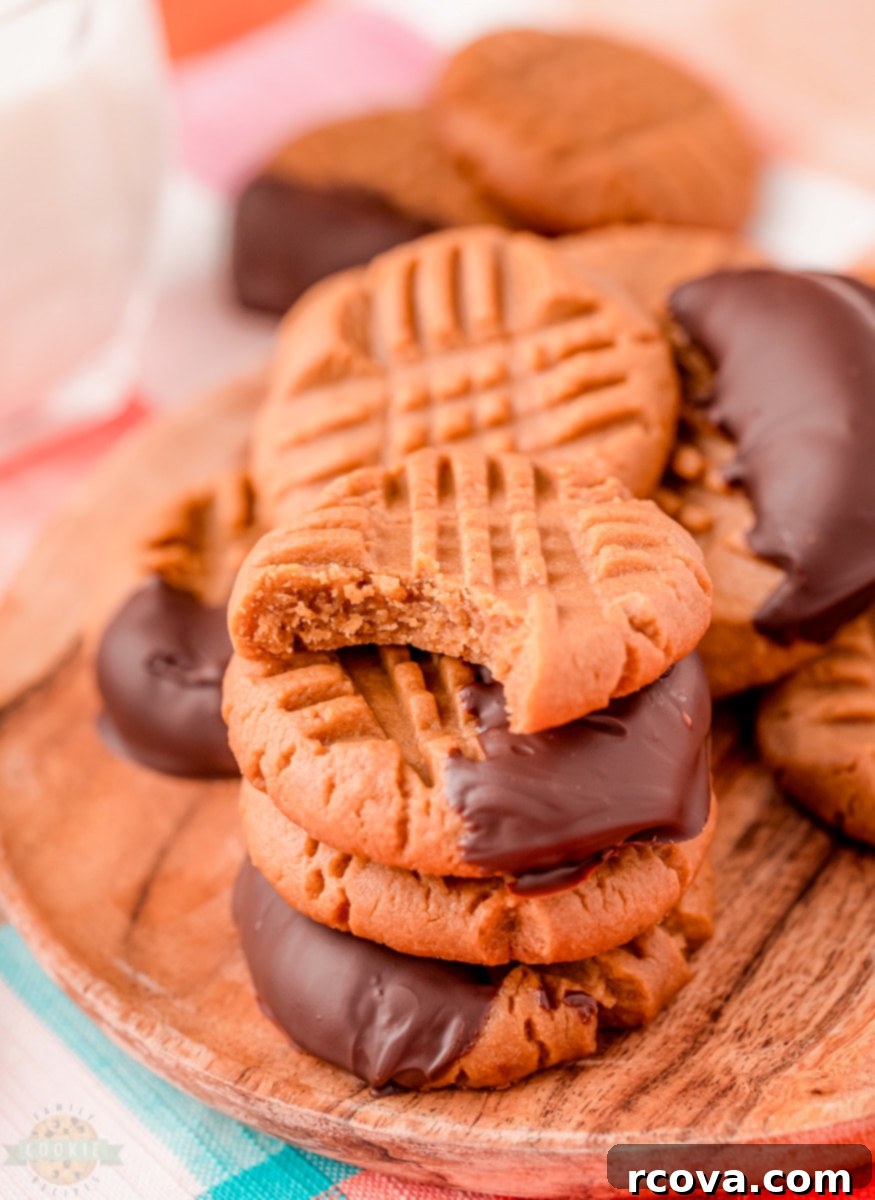 Low Carb Peanut Butter Cookies 5 Keto peanut butter cookie dough balls with fork marks on a baking sheet
