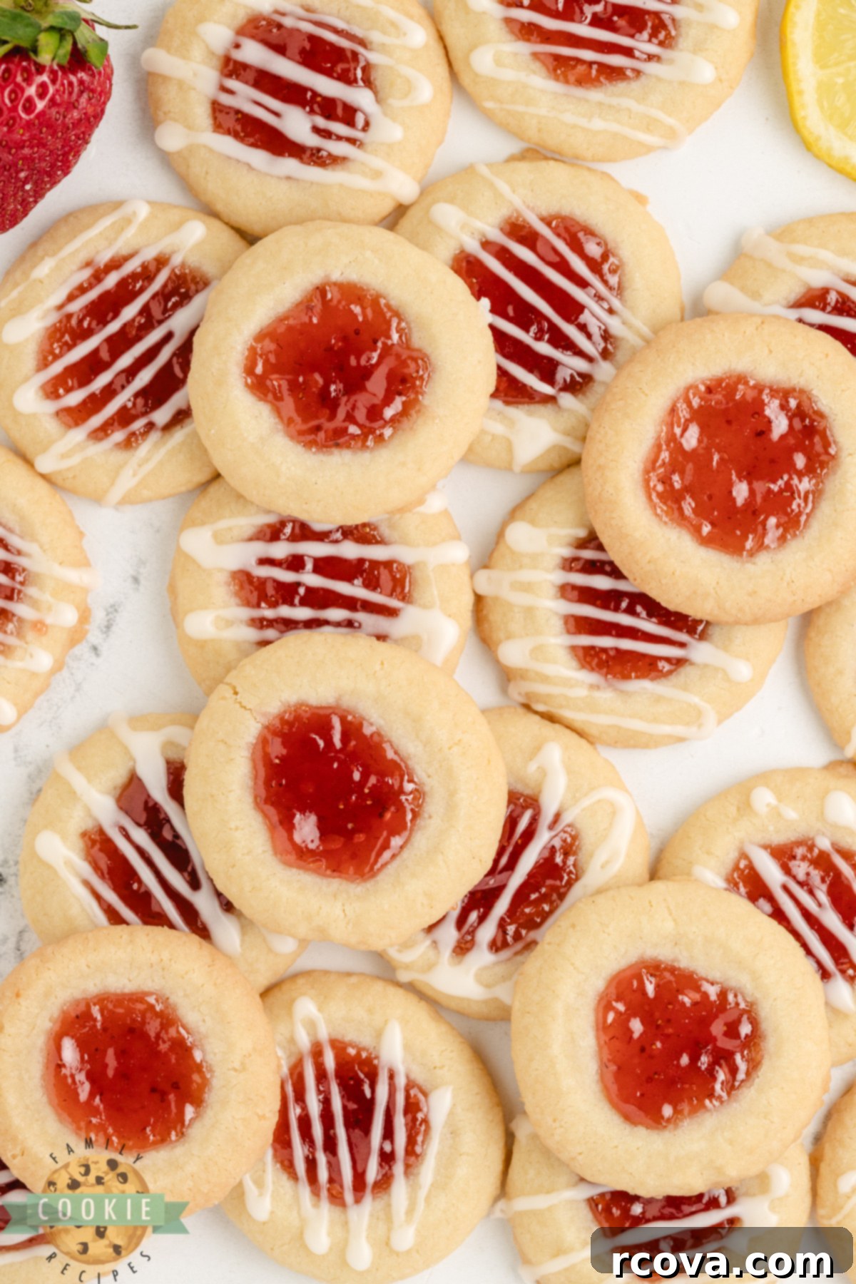 Strawberry Lemon Drop Cookies 7 A plate of Strawberry Lemon Thumbprint Cookies, showcasing their buttery texture, strawberry jam, and lemon glaze.