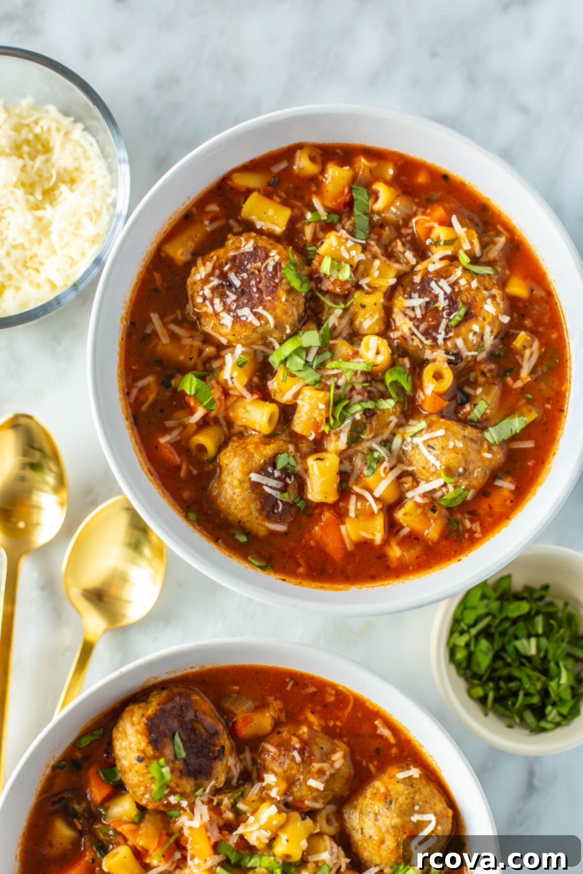 Your New Favorite Turkey Meatball Soup 9 Detailed close-up of a single serving of Italian Turkey Meatball Soup, showcasing the tender meatballs, small ditalini pasta, and vibrant vegetables, topped with Parmesan and fresh herbs.