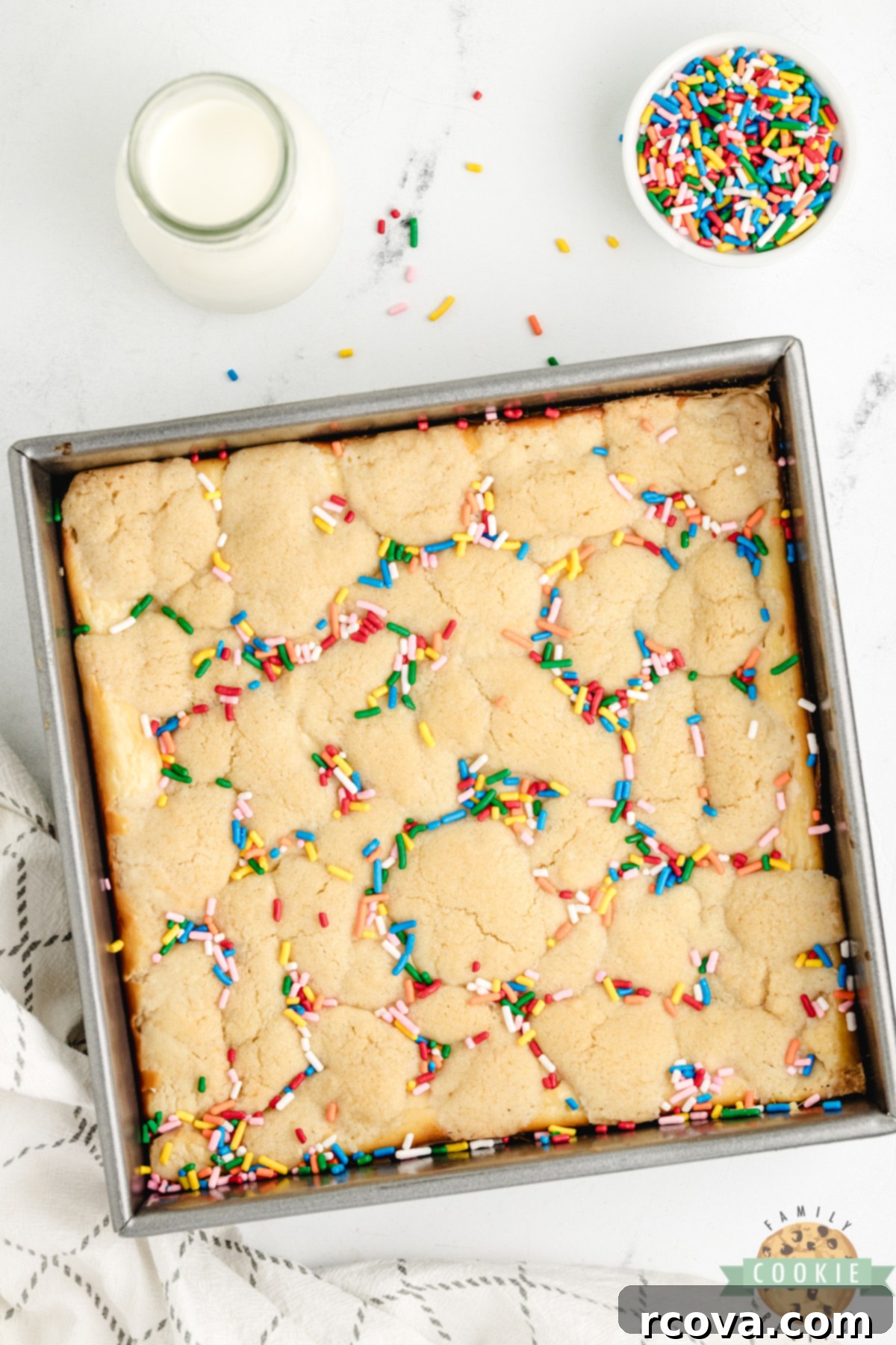 Sugar Cookie Cheesecake Bars 5 Sugar cookie bars with sprinkles and cheesecake filling.