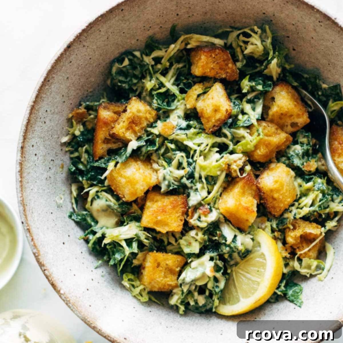 14 Effortless and Delectable Brussels Sprouts Dishes 9 Brussels & Kale Caesar with Cheezy Garlic Croutons via Pinch of Yum