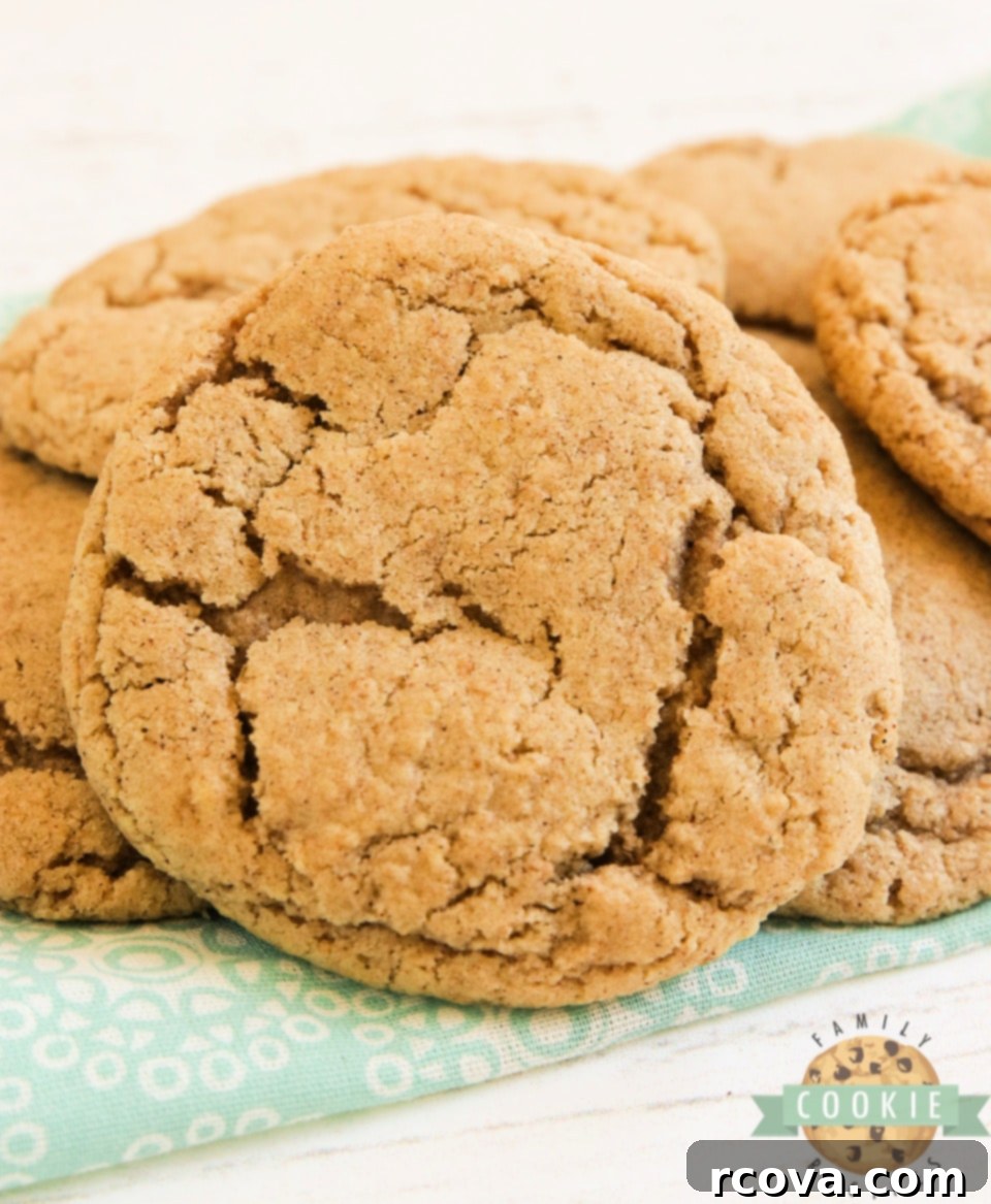 Aromatic Cinnamon Oat Delights 8 A tray of warm Cinnamon Oatmeal Cookies, cooling after baking, highlighting their golden color and texture.