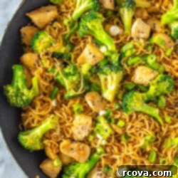 Effortless 30-Minute Chicken Ramen Stir Fry 11 A close-up of a skillet filled with chicken ramen stir fry.