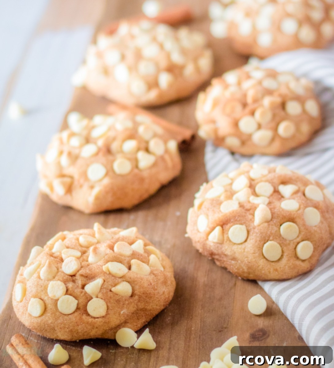 Thick and Chewy Snickerdoodle Cookies 3 Stack of giant white chocolate snickerdoodle cookies on a cooling rack, showing their impressive size