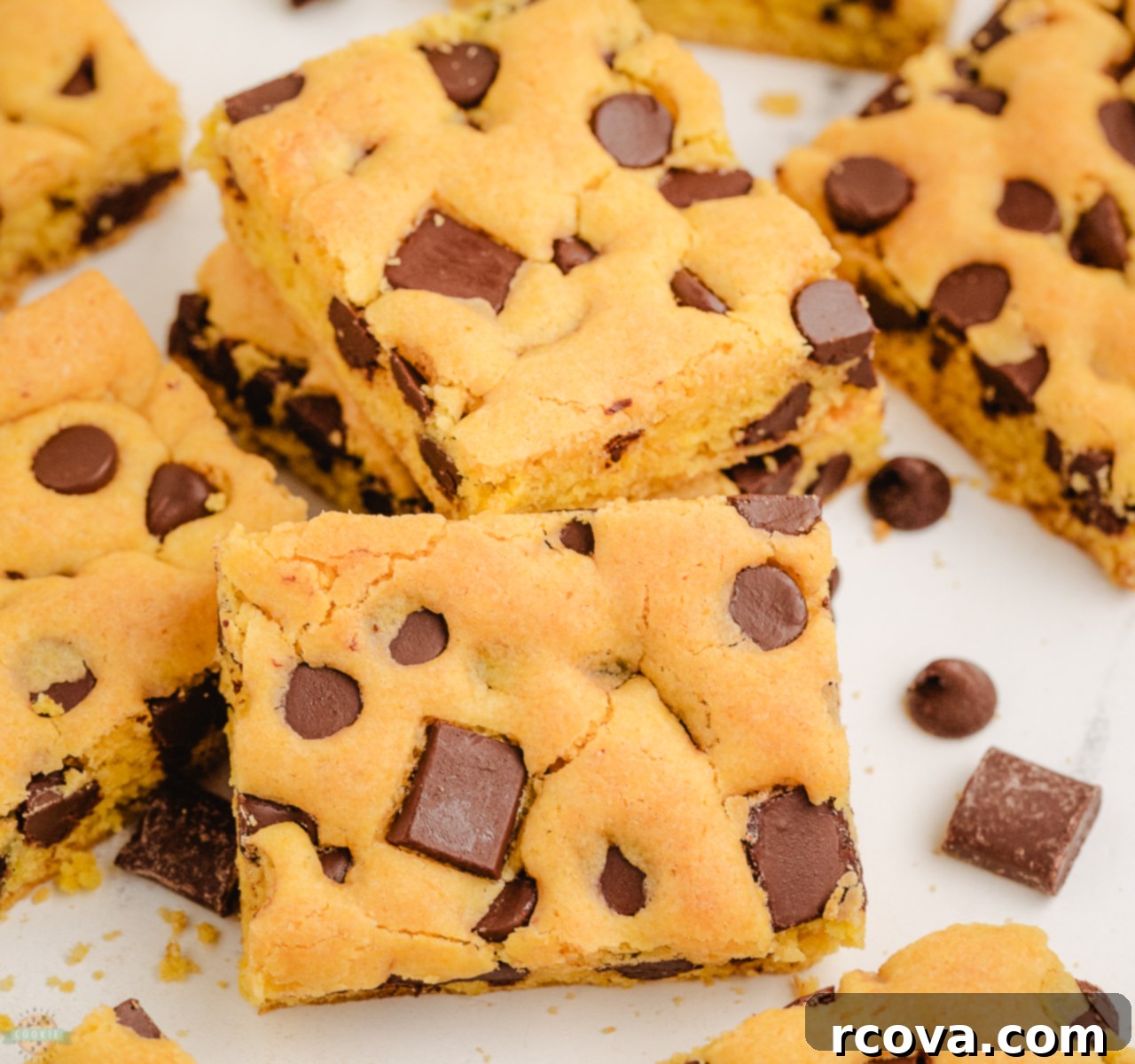 Golden Cake Mix Cookie Bar Delights 2 Golden brown yellow cake mix cookie bars cut into perfect squares, ready to serve on a plate.