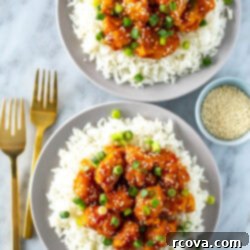 Quick Mandarin Chicken Delight 11 Two plates, each with a bed of rice, topped with crispy mandarin chicken.