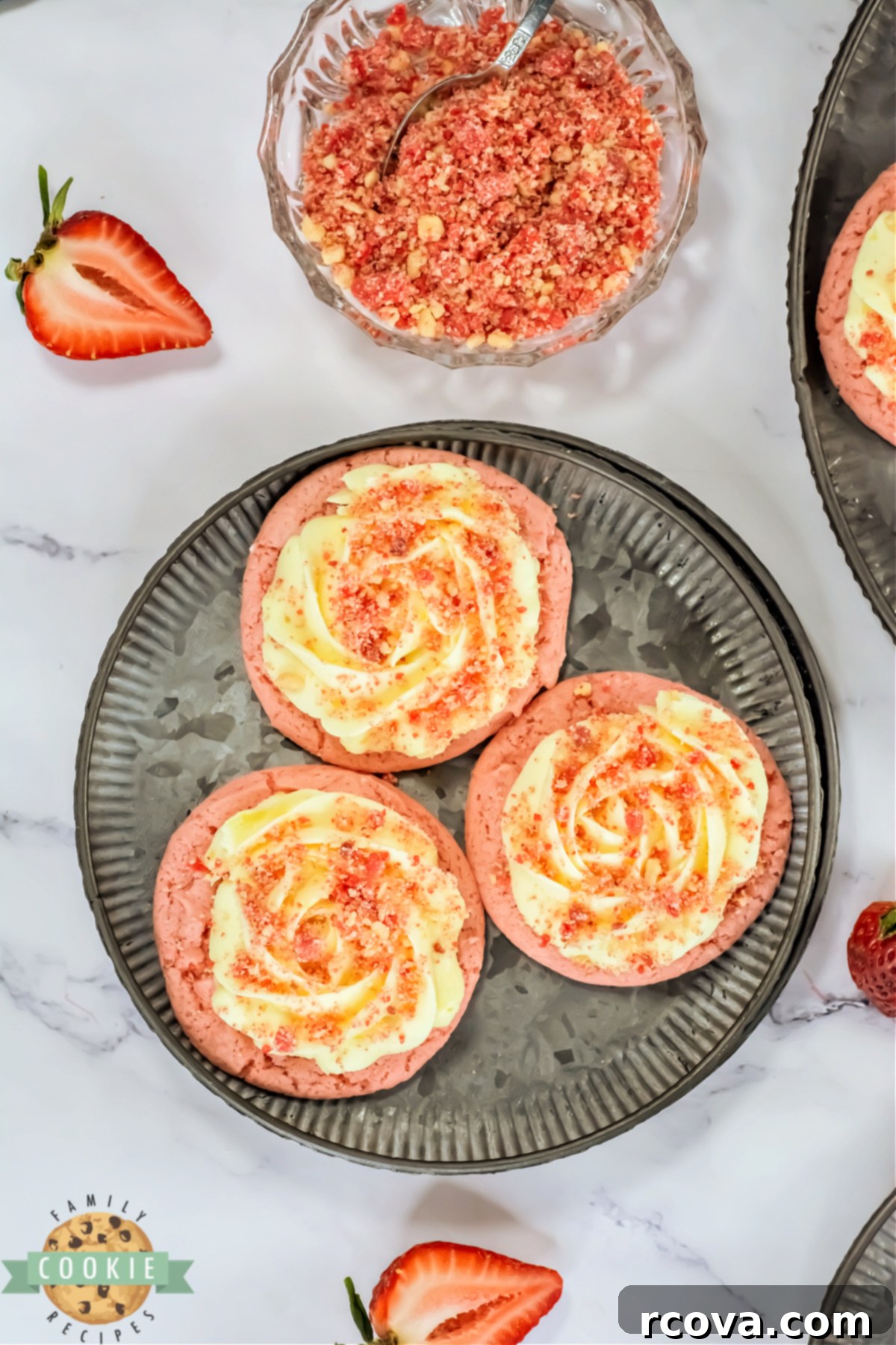 Bakery Style Strawberry Shortcake Cookies 5 A batch of freshly baked Copycat Crumbl Strawberry Shortcake Cookies cooling on a wire rack, showcasing their soft texture and vibrant color.