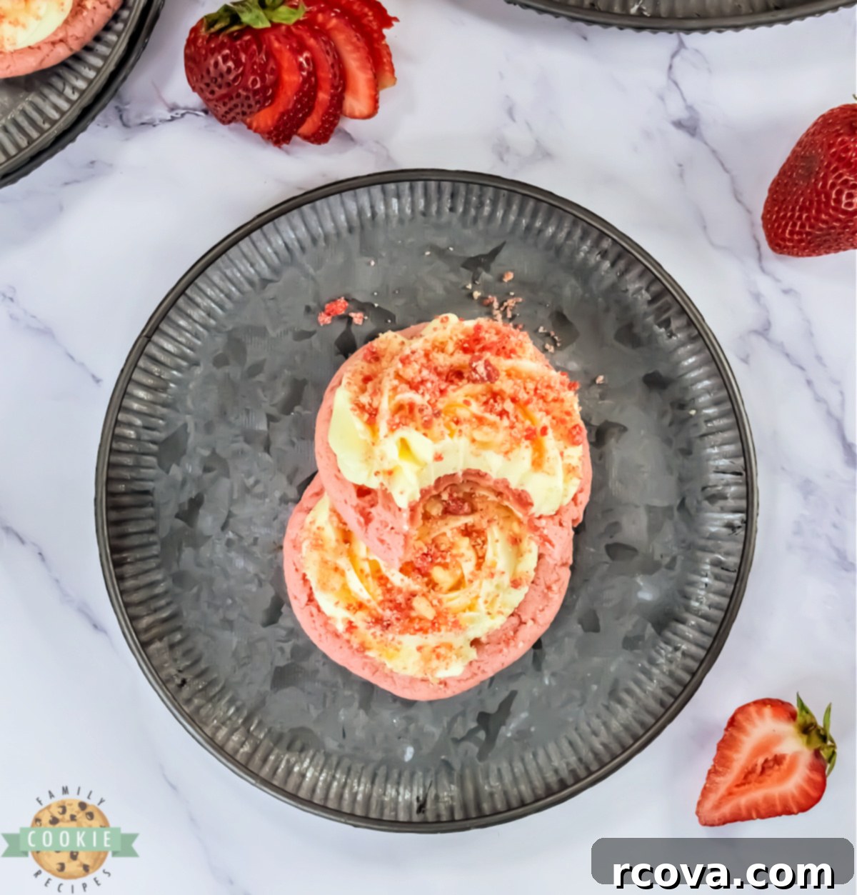 Bakery Style Strawberry Shortcake Cookies 6 Close-up of a single Copycat Crumbl Strawberry Shortcake Cookie, showcasing its rich vanilla frosting swirl and vibrant strawberry streusel.