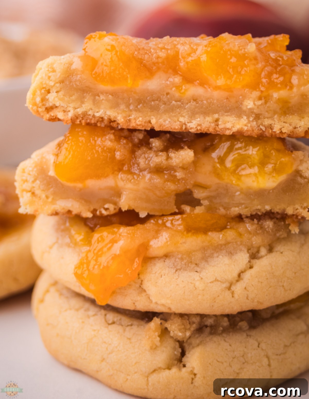 Peachy Cobbler Cookies 4 Stack of freshly baked peach cookies with a crumbly cobbler topping, ready to be enjoyed