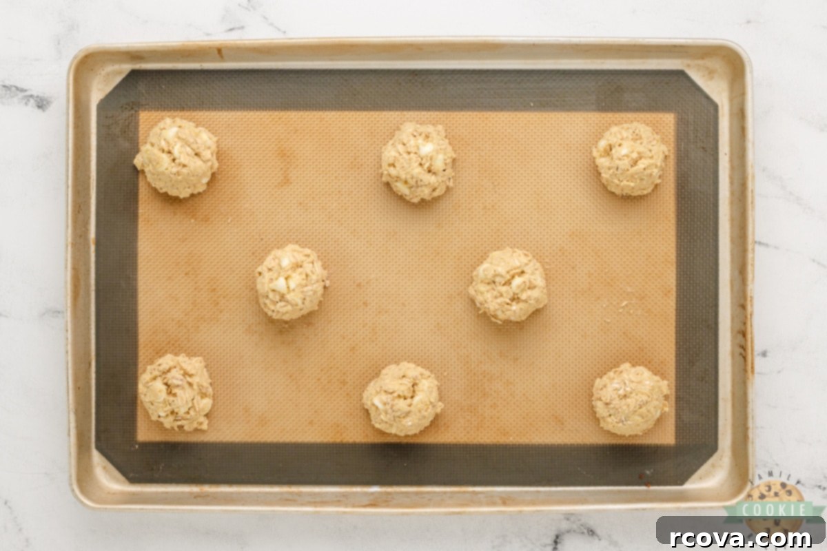 Zesty Lemon Oat Cookies 11 Spoonfuls of cookie dough on cookie sheet.