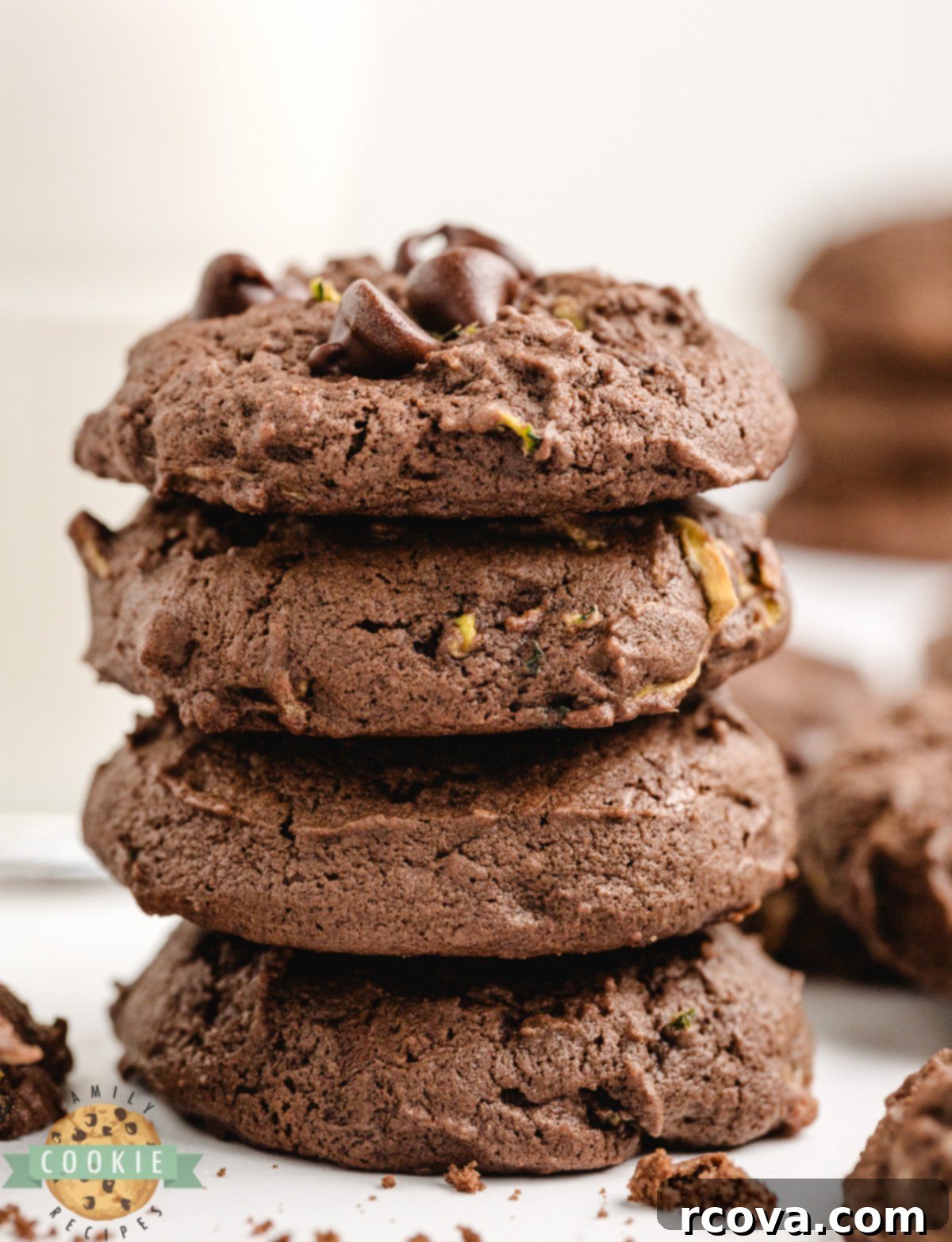 Decadent Chocolate Zucchini Cookies 5 A stack of soft chocolate zucchini cookies with melty chocolate chips visible throughout.