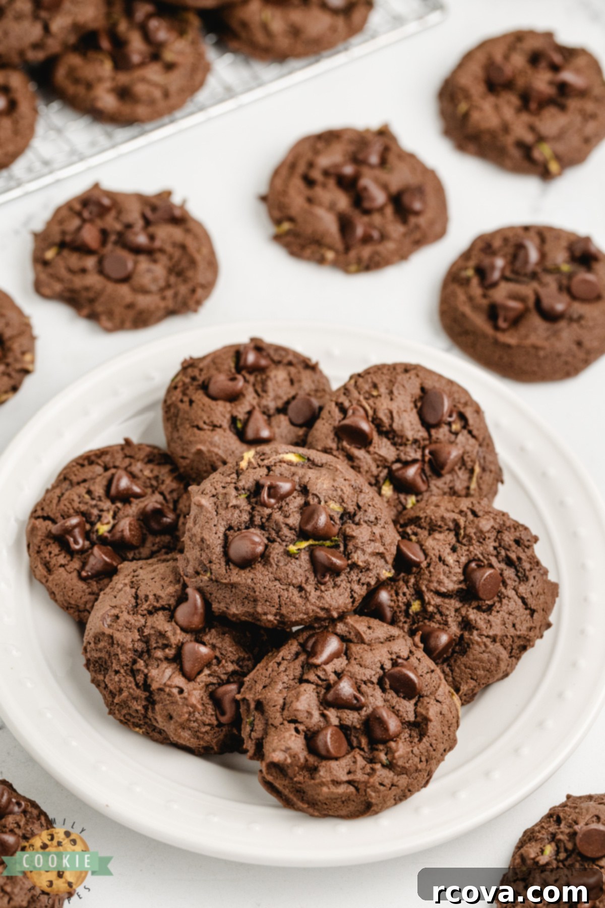 Decadent Chocolate Zucchini Cookies 6 Pile of chocolate zucchini cookies on a white plate.