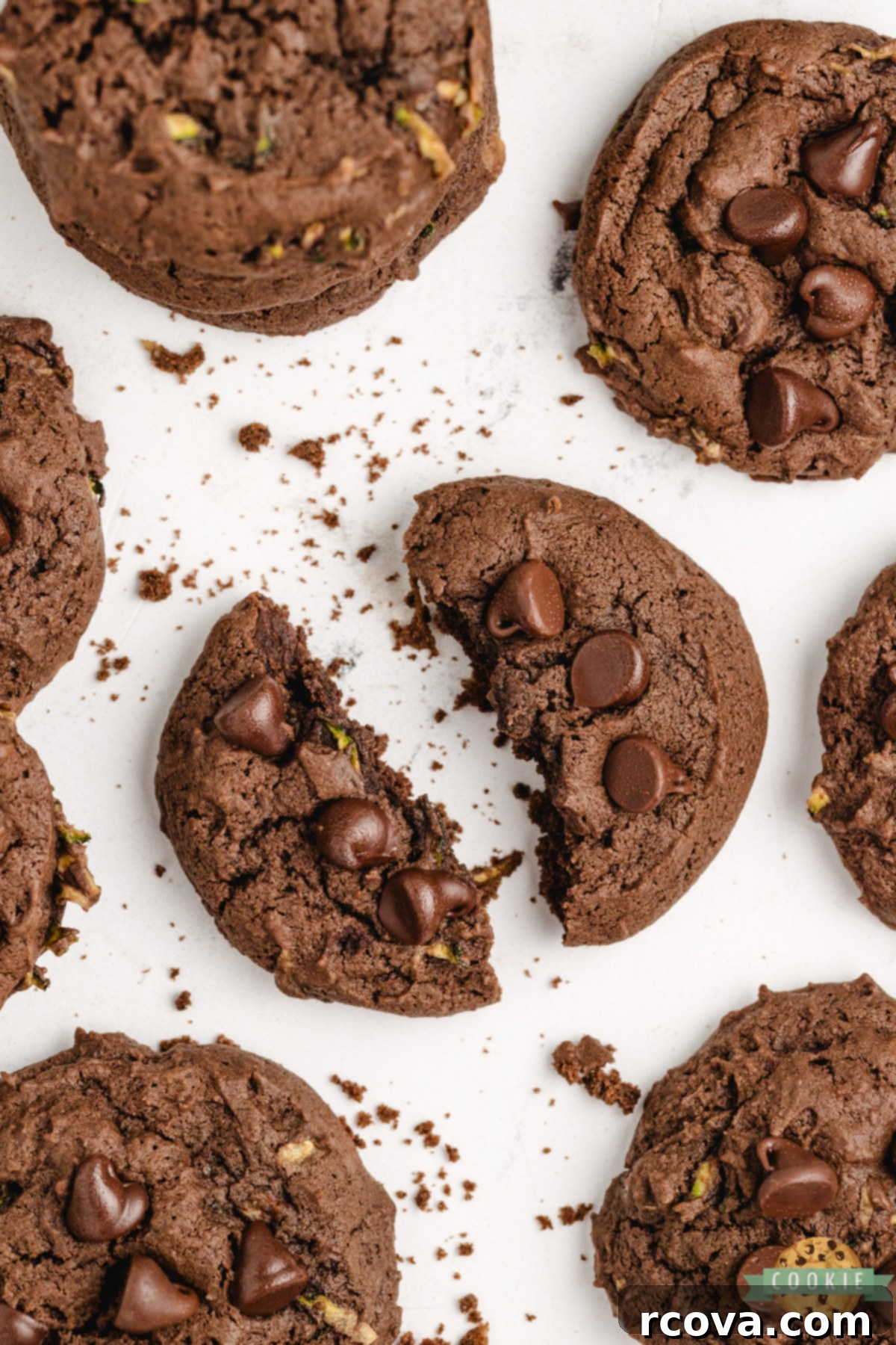 Decadent Chocolate Zucchini Cookies 8 Close-up of a fudgy chocolate zucchini cookie broken in half, showing the rich, moist center.