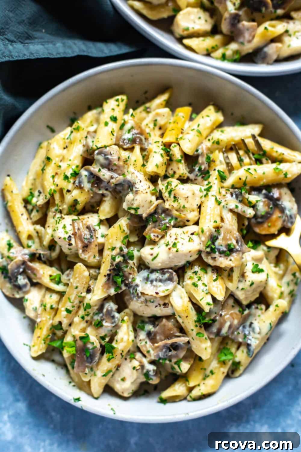 Deliciously Healthy Mushroom Recipes 13 Lighter Instant Pot Chicken Alfredo with mushrooms and parsley.