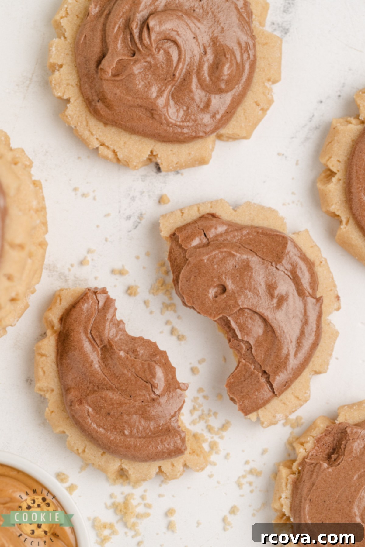 Peanut Butter Sugar Cookie Perfection 6 Peanut Butter Sugar Cookies are soft, thick, and topped with rich chocolate frosting. Easy to make, big batch friendly, and freezer safe!