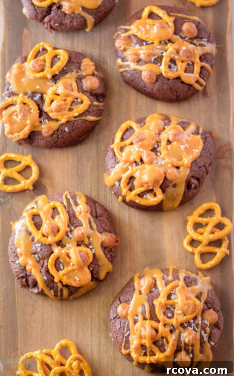 Fudgy Salted Caramel Brownie Cookies 8 A stack of Salted Caramel Brownie Cookies with caramel visible.