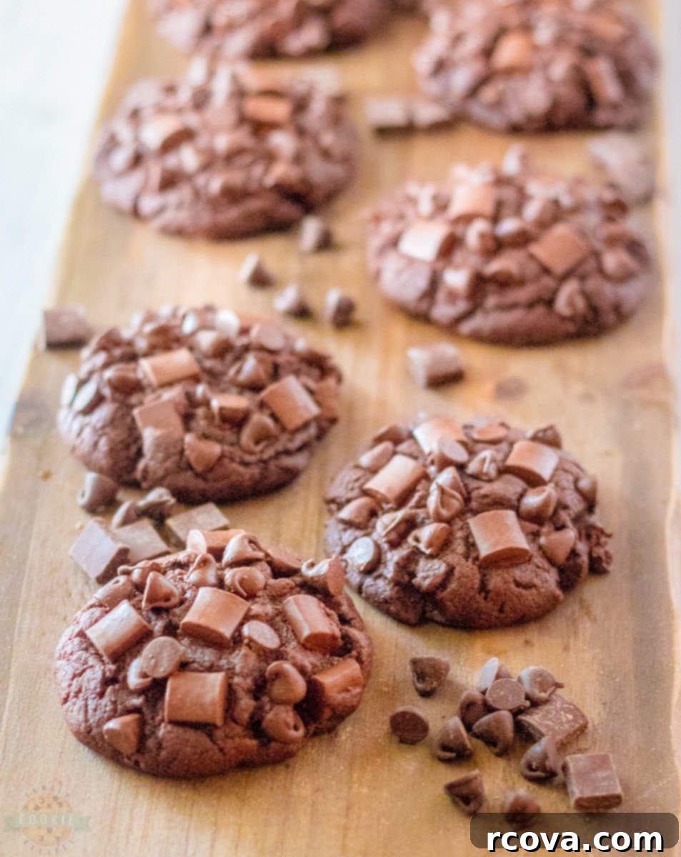 Ultimate Brownie Cookies 4 Chocolate brownie cookie dough being perfectly scooped onto a baking sheet, preparing for oven time.