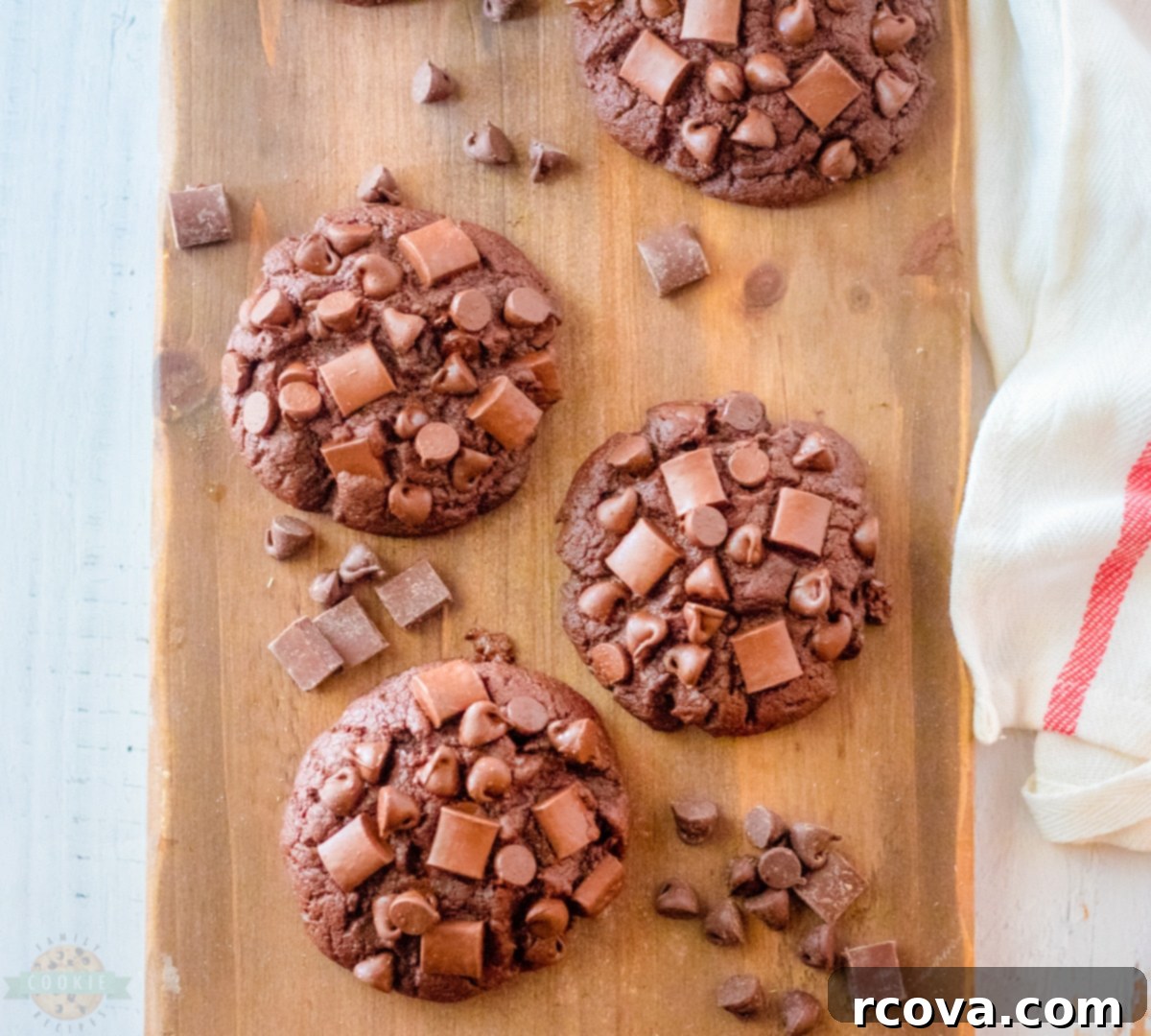 Ultimate Brownie Cookies 9 Several large, soft chocolate brownie cookies displayed artfully on a light-colored platter, ready to be served.