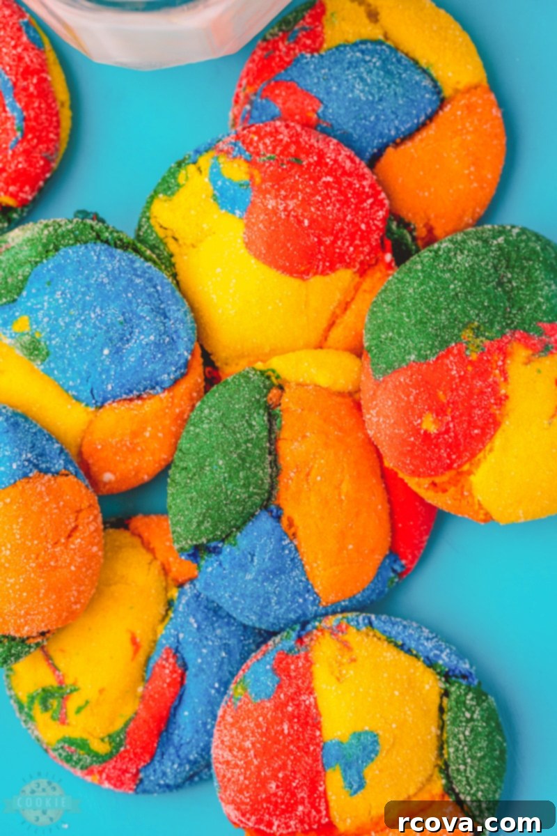 Colorburst Cookies 2 Vibrant and colorful cake mix cookies arranged artfully on a cooling rack, showcasing their cheerful hues.