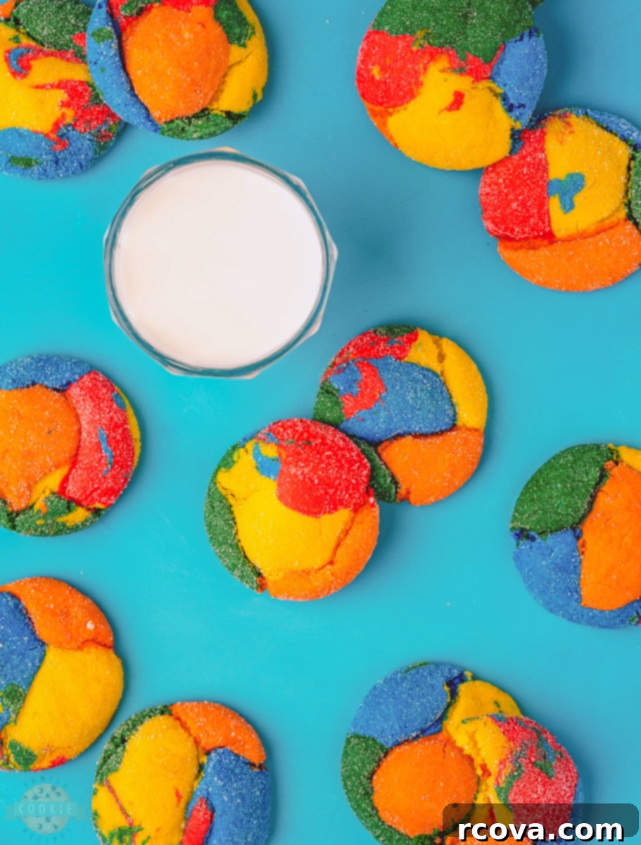 Colorburst Cookies 4 A selection of vibrant, freshly baked colorful cake mix cookies arranged on a white plate, ready to be enjoyed.