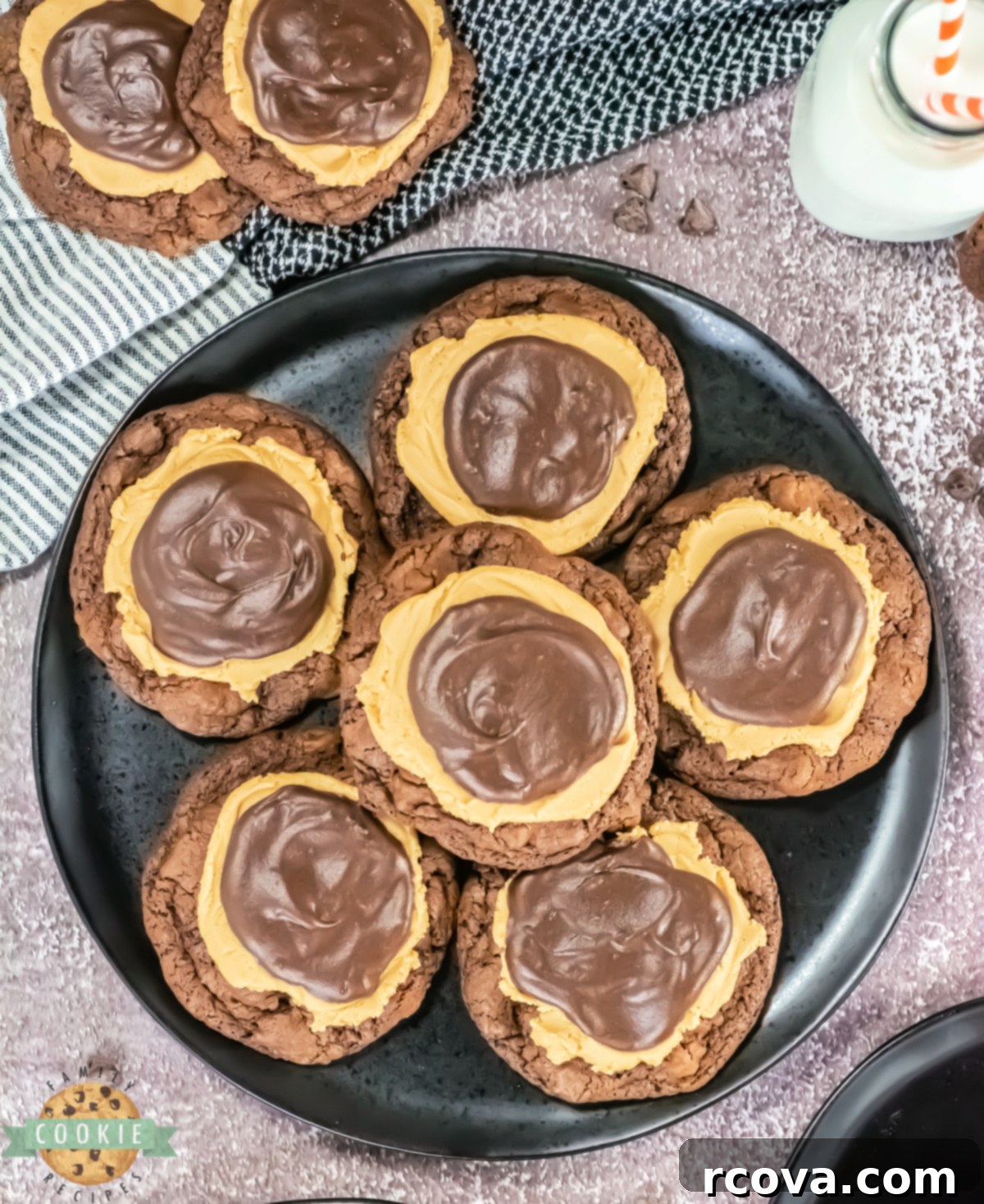 Peanut Butter Fudge Brownie Cookies 8 A plate of Crumbl Copycat Buckeye Brownie Cookies ready to be served, highlighting the thick chocolate base, peanut butter frosting, and shiny ganache topping.