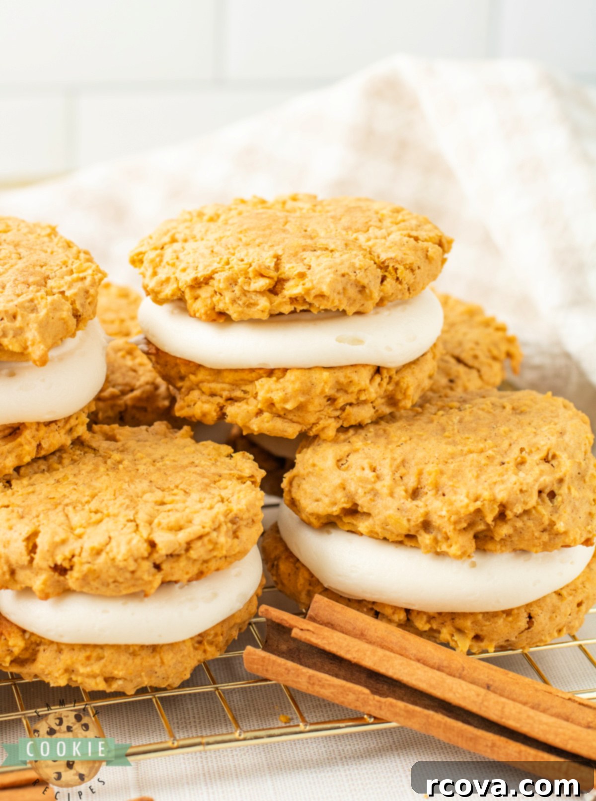 Pumpkin Spice Oatmeal Creamwiches 5 Stack of pumpkin oatmeal sandwich cookies filled with cream cheese frosting.