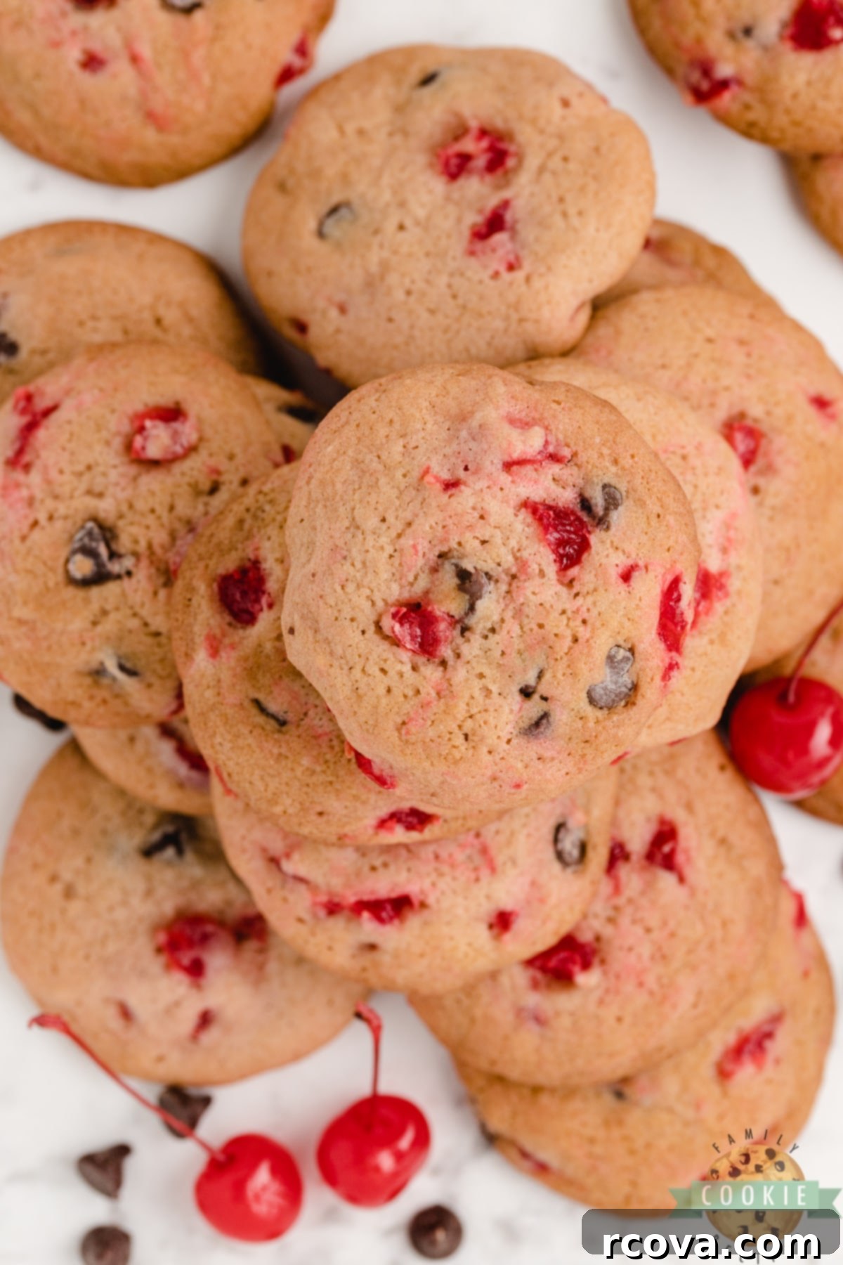 Decadent Cherry Chocolate Chip Cookies 10 A pile of homemade Cherry Chocolate Chip Cookies, showcasing their delightful texture and ingredients.