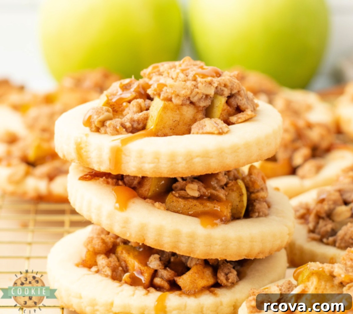 Spiced Apple Crumble Cookies 2 Apple Crumble Cookies are filled with cinnamon-spiced apples, topped with a buttery oat crumble, and drizzled with caramel.
