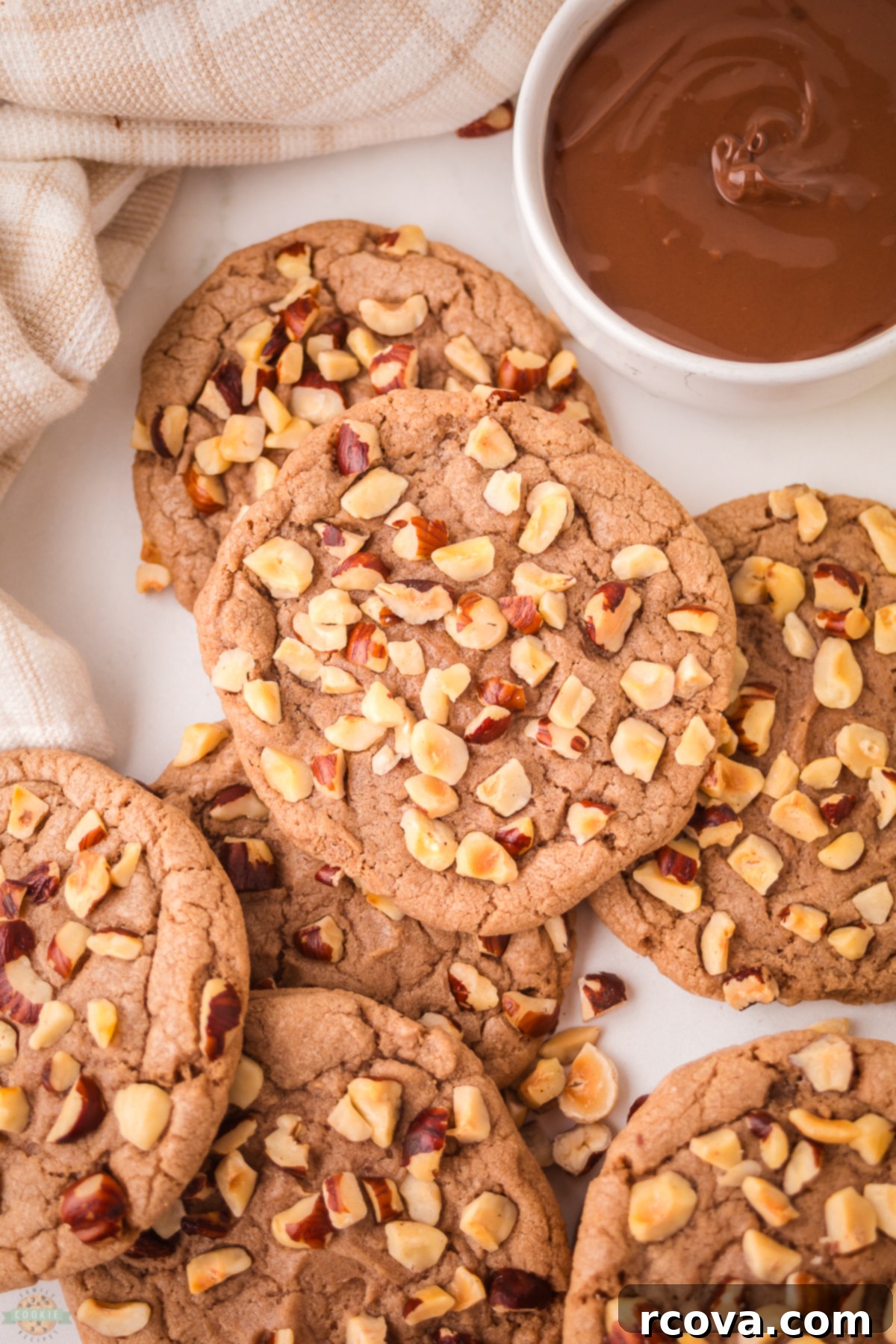 Decadent Chocolate Hazelnut Cookies 2 Delicious chocolate hazelnut cookies stacked on a plate, showcasing their rich texture and hazelnut coating.