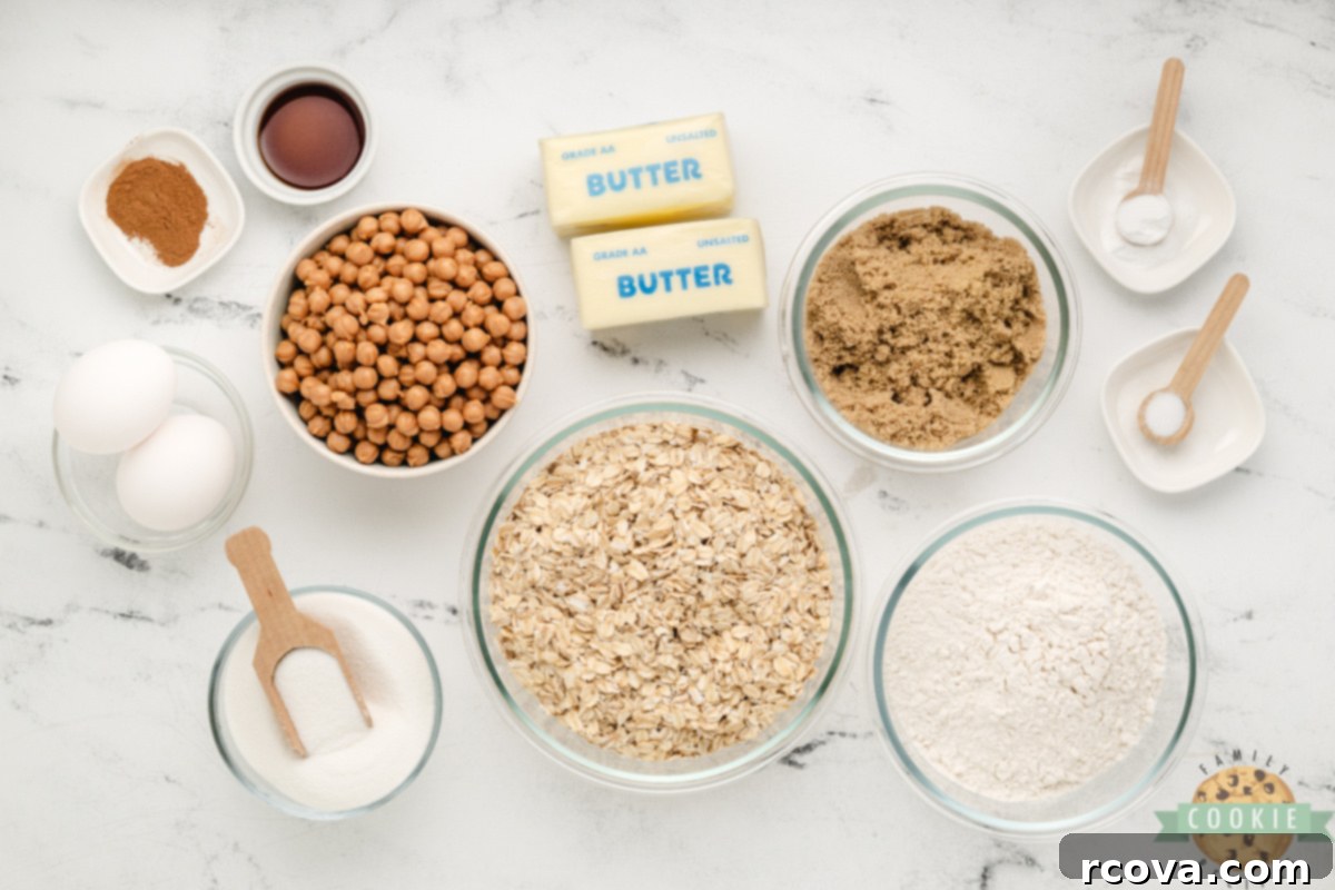 Golden Oat & Caramel Goodness 3 Essential ingredients laid out for making delicious Caramel Oatmeal Cookies, including butter, sugars, oats, and caramel bits.