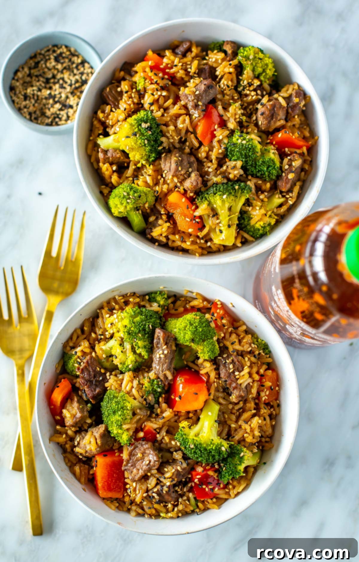 26 Easy and Healthy Pantry Dinners 14 Two bowls of Instant Pot beef and broccoli with a bottle of sriracha on the side.