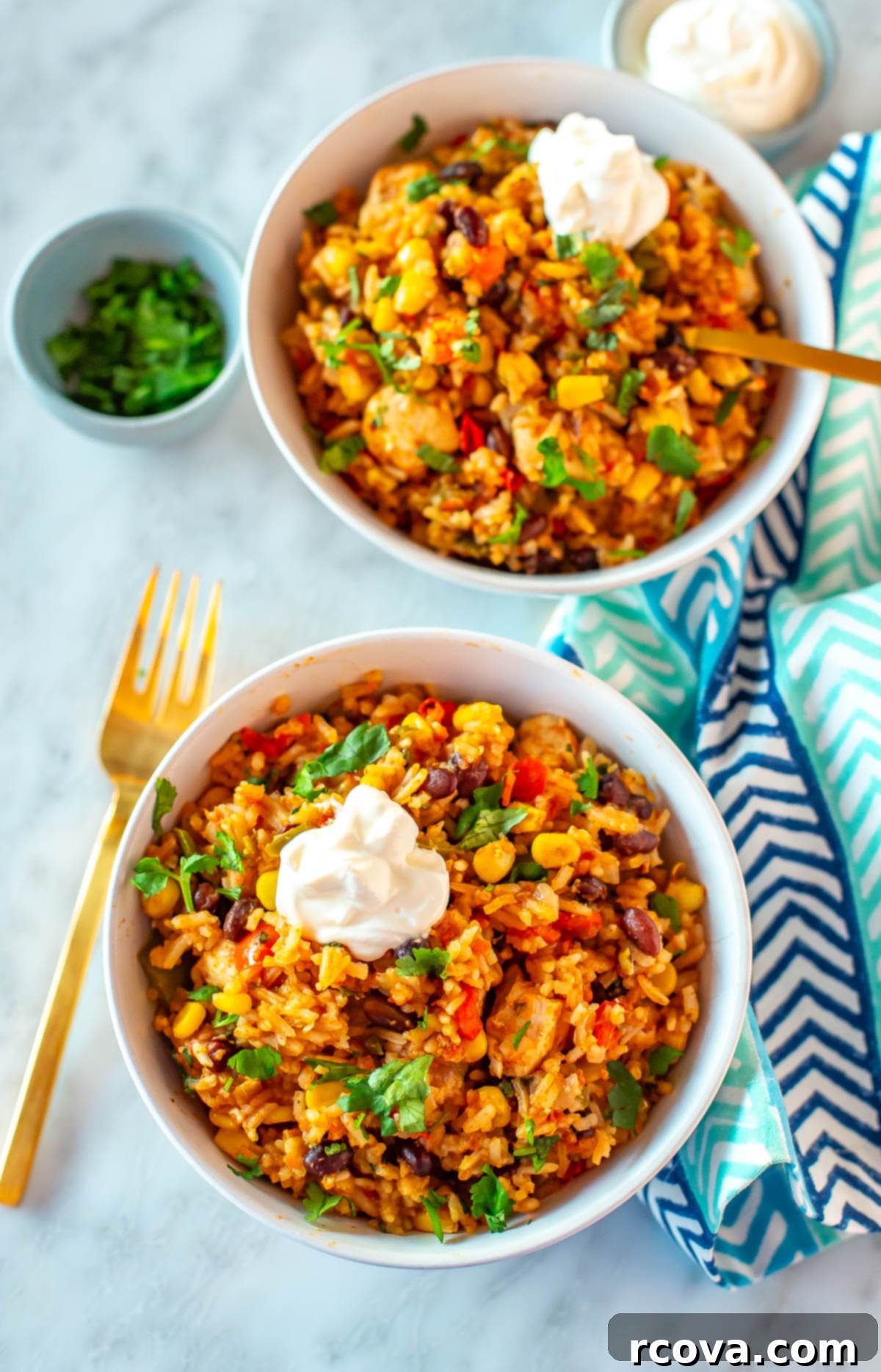 26 Easy and Healthy Pantry Dinners 17 Two Instant Pot chicken burrito bowls topped with sour cream.